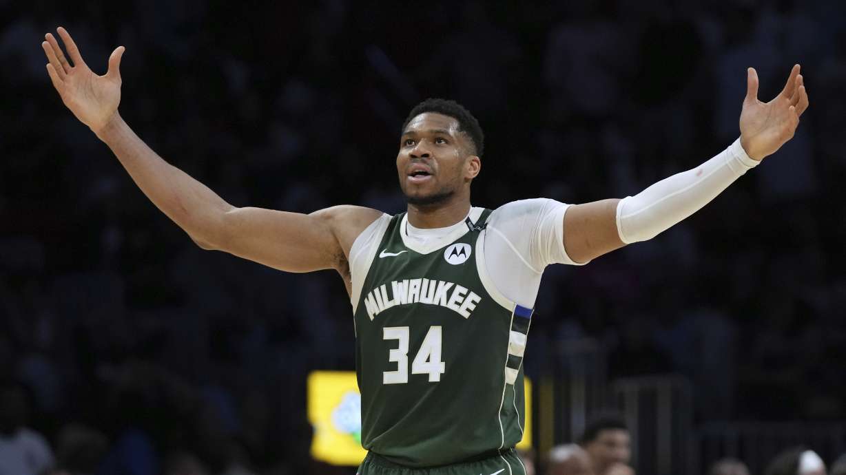Milwaukee Bucks forward Giannis Antetokounmpo (34) reacts after Kevin Porter Jr. scored during overtime in an NBA basketball game against the Miami Heat, Saturday, April 5, 2025, in Miami.