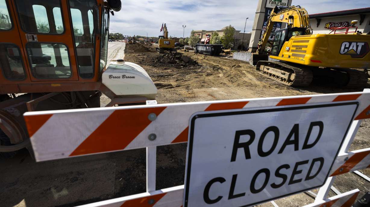 A road closed sign sits in front of part of a construction project to widen 1800 North in Sunset on Tuesday. UDOT has announced 152 new construction projects worth $1.68 billion, with another 145 projects already in progress.