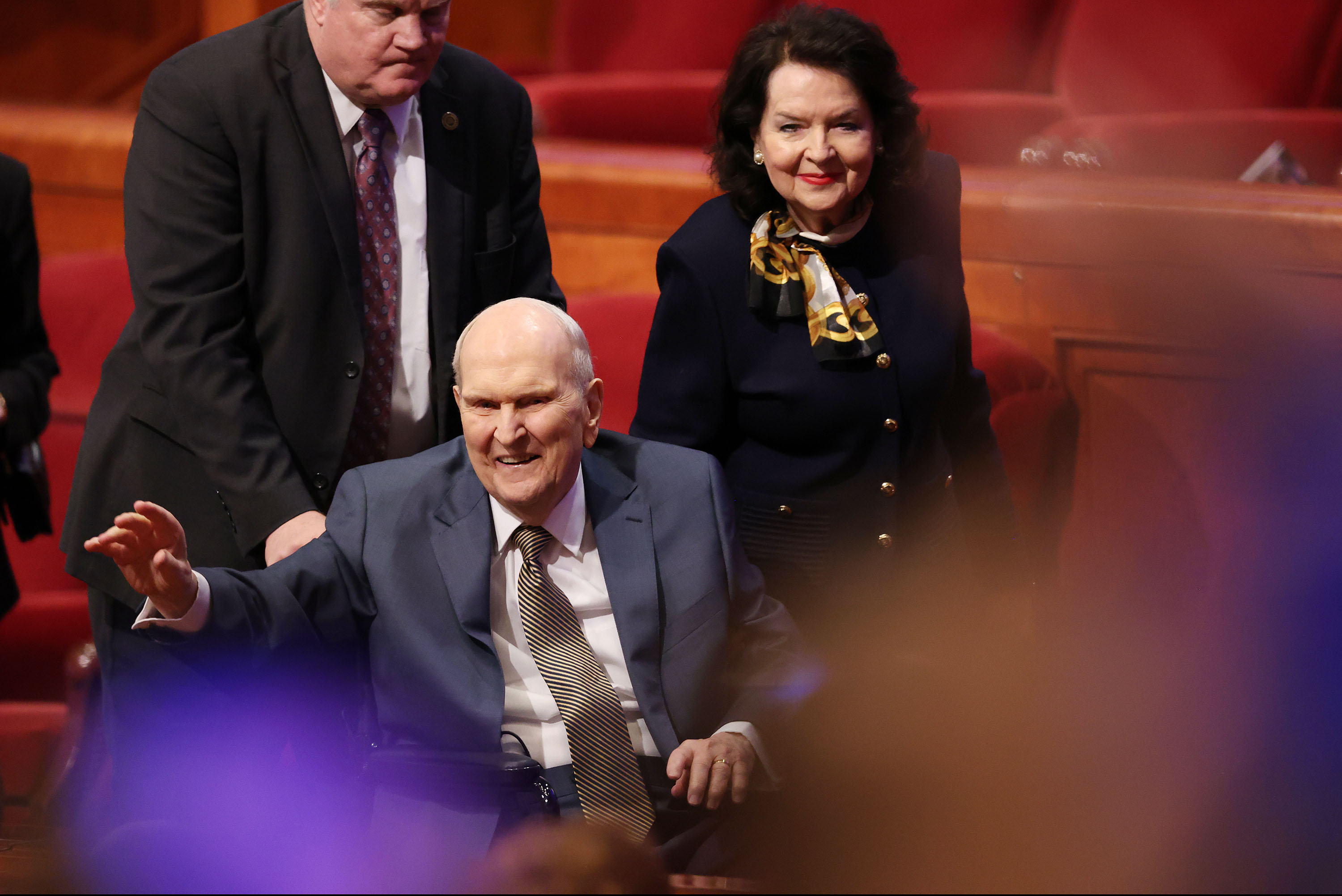 President Russell M. Nelson of The Church of Jesus Christ of Latter-day Saints and his wife Sister Wendy Nelson wave to attendees as they wave to him after the Sunday afternoon session of the 195th annual General Conference of The Church of Jesus Christ of Latter-day Saints in Salt Lake City on April 6.