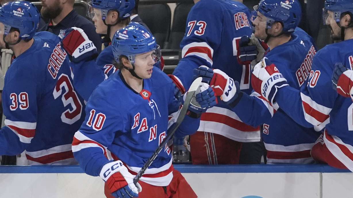 FILE - New York Rangers' Artemi Panarin (10) celebrates with teammates after scoring a goal during the first period of an NHL hockey game against the Calgary Flames Tuesday, March 18, 2025, in New York.