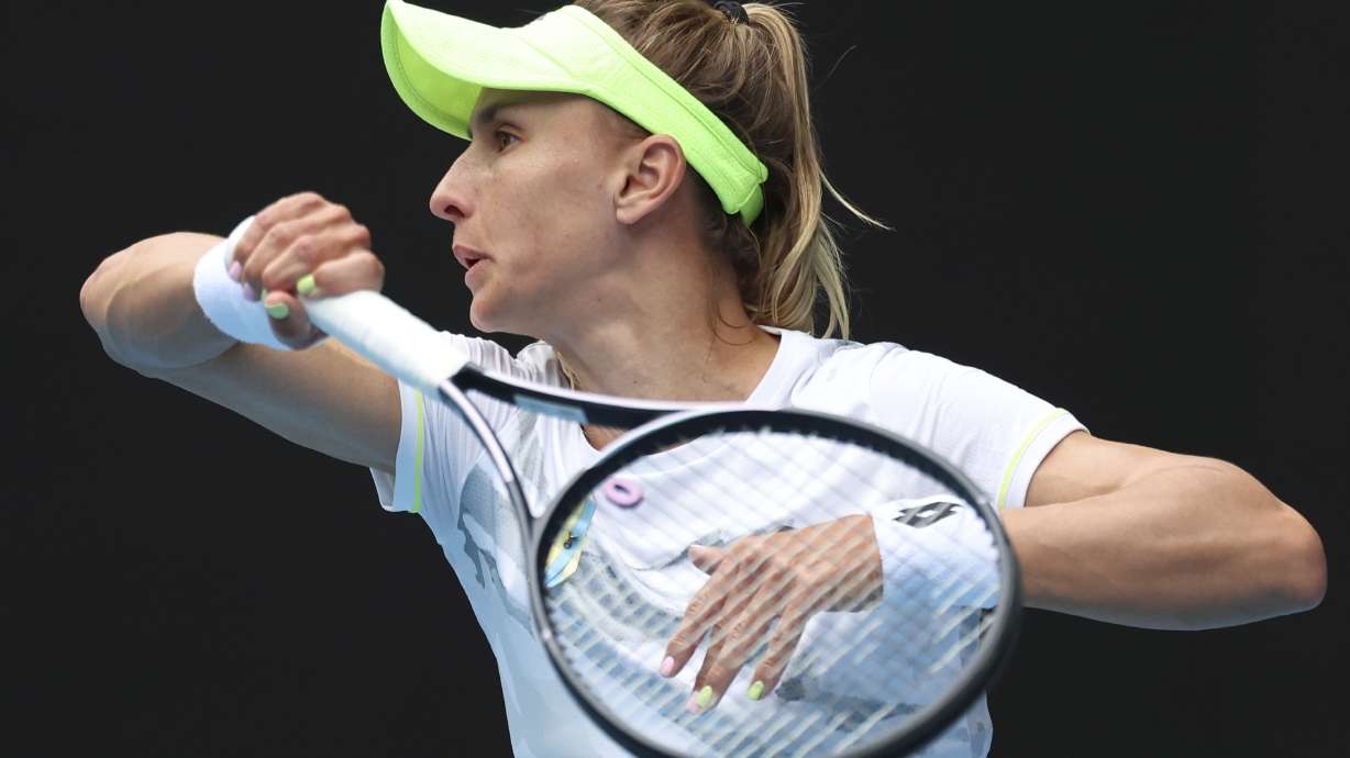 FILE - Lesia Tsurenko of Ukraine plays a forehand return to Aryna Sabalenka of Belarus during their third round match at the Australian Open tennis championships at Melbourne Park, Melbourne, Australia, Jan. 19, 2024.