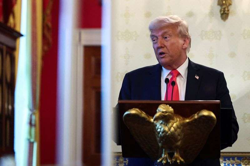 President Donald Trump speaks during a prayer service and dinner ahead of Easter Sunday, at the White House in Washington, Wednesday.