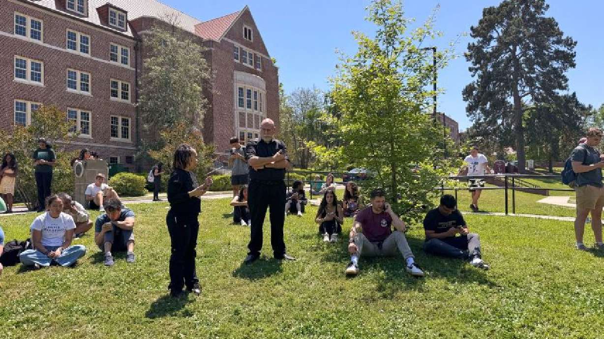 Florida State University students wait for news amid an active shooter incident at the school’s campus in Tallahassee, Fla., Thursday.