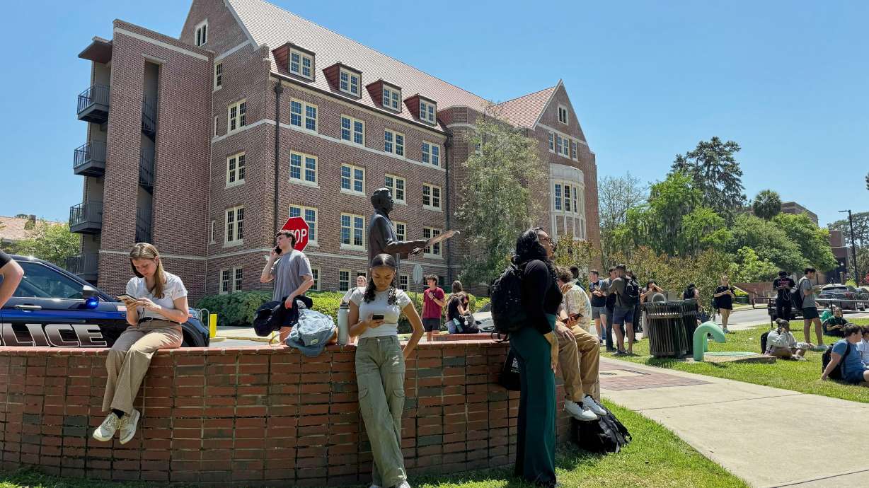 Florida State University students wait for news amid an active shooter incident at the school’s campus in Tallahassee, Fla., Thursday, April 17, 2025