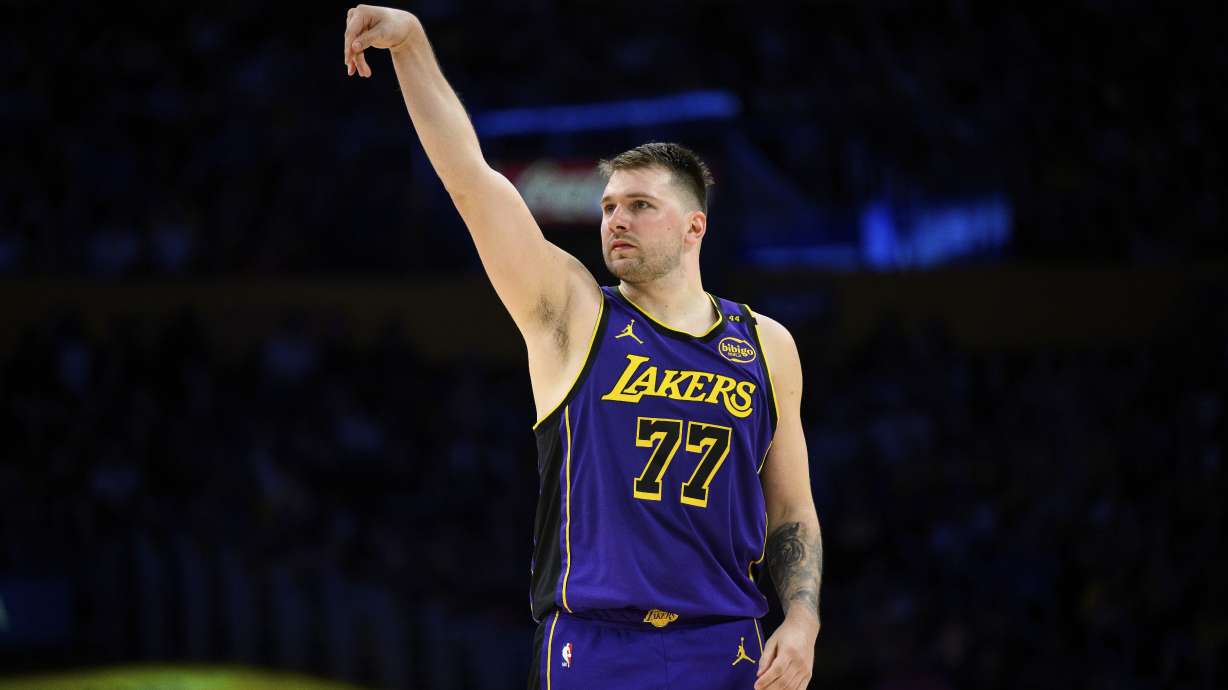 Los Angeles Lakers guard Luka Doncic watches his 3-point shot go in during the second half of an NBA basketball game against the New Orleans Pelicans, Friday, April 4, 2025, in Los Angeles.