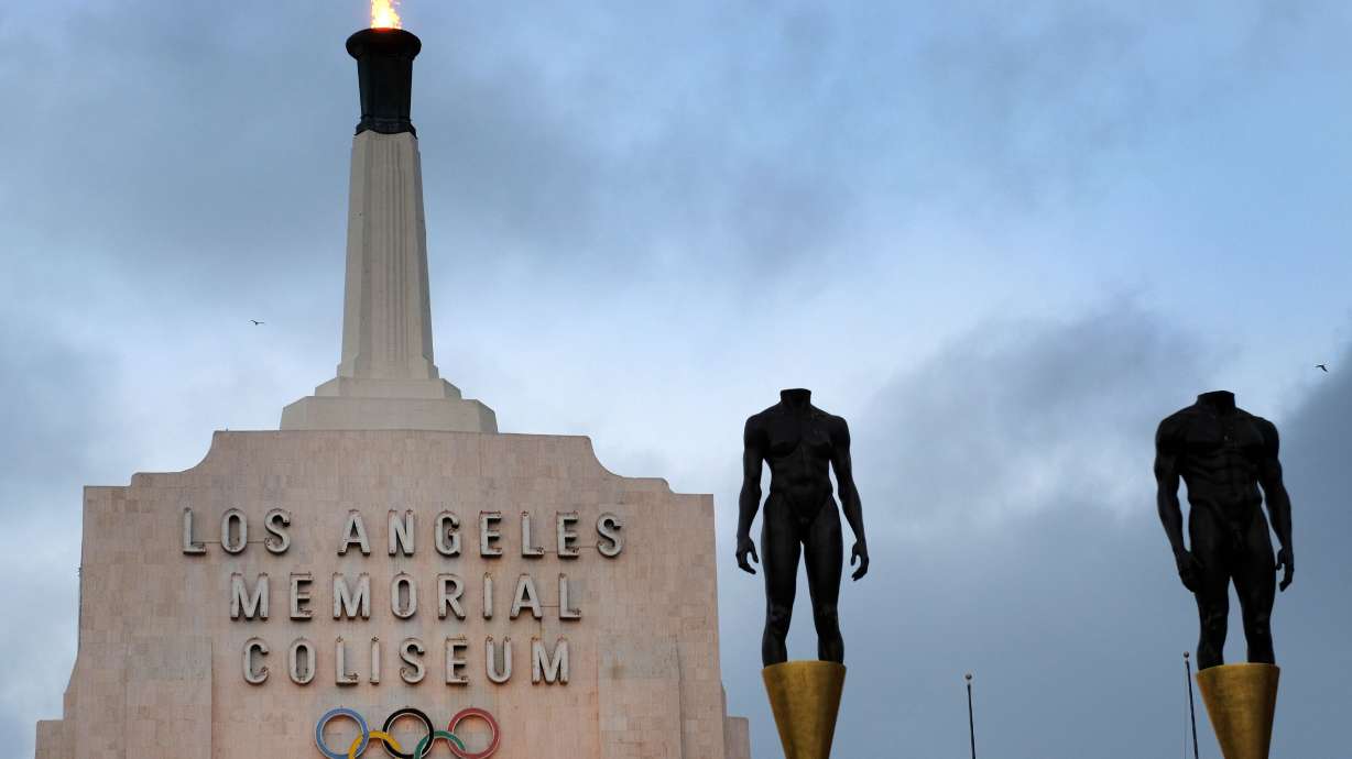 The Olympic cauldron at the Los Angeles Memorial Coliseum. Top U.S. Olympic officials are being reassured President Donald Trump's proposed travel restrictions won't keep athletes away from the 2028 Summer Games in Los Angeles.