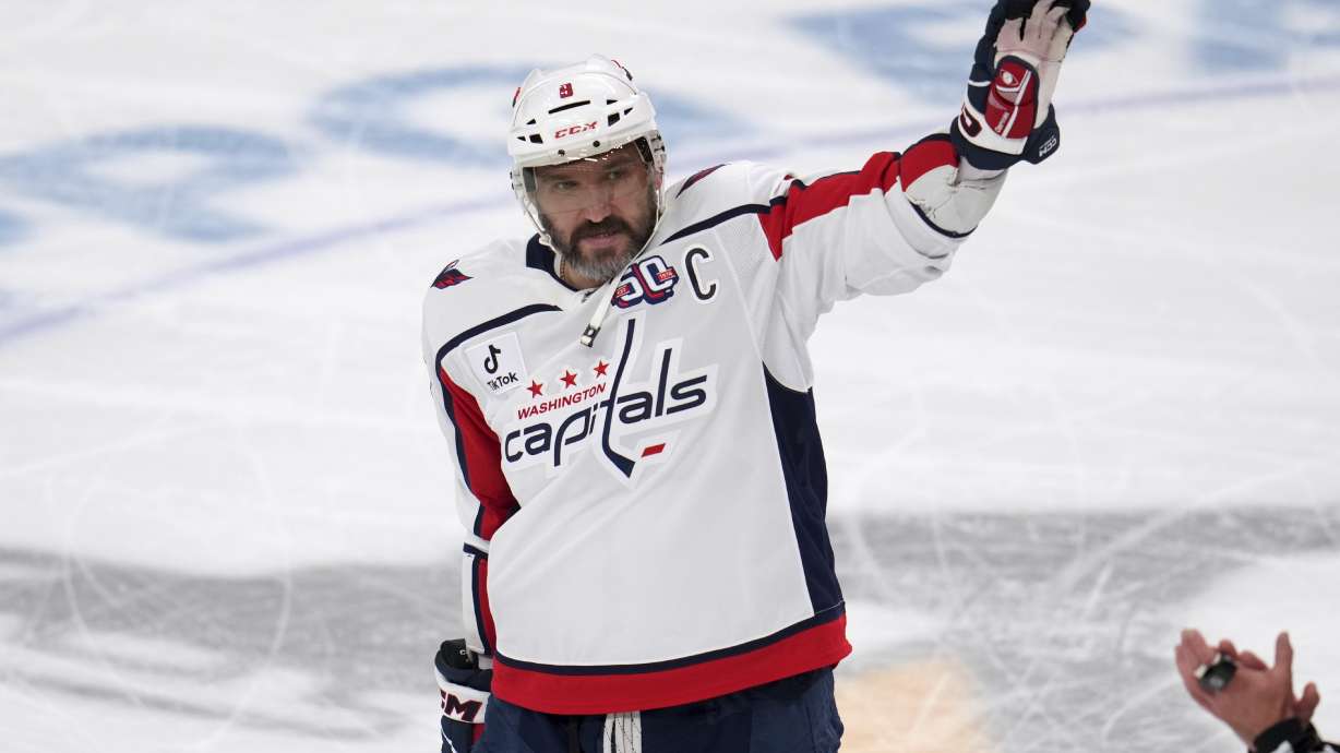 Washington Capitals' Alex Ovechkin acknowledges fans during a scoreboard tribute during the first period of an NHL hockey game against the Pittsburgh Penguins in Pittsburgh, Thursday, April 17, 2025.