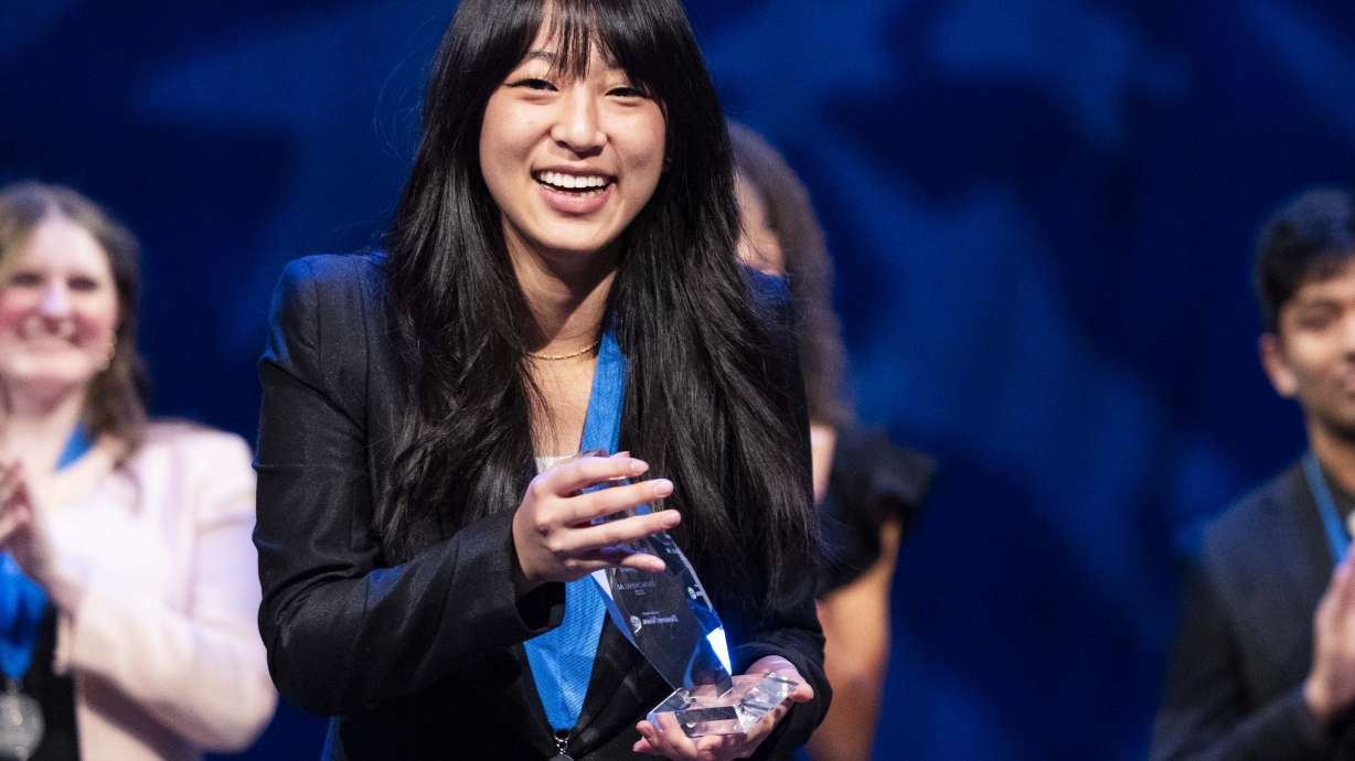 Xiaocheng Ai smiles upon receiving the General Sterling Scholar Award at the 2025 Sterling Scholar ceremony at the Conference Center Little Theater in Salt Lake City on Thursday.