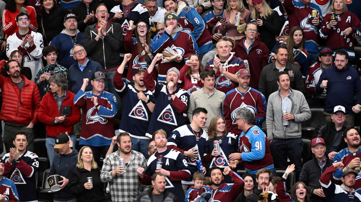 Colorado Avalanche fans cheer after a goal against the Vegas Golden Knights in the second period of an NHL hockey game Tuesday, April 8, 2025, in Denver.