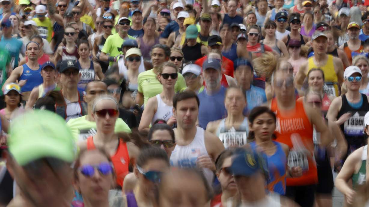 FILE - A wave a runners set out from the start of the Boston Marathon, April 15, 2024, in Hopkinton, Mass.
