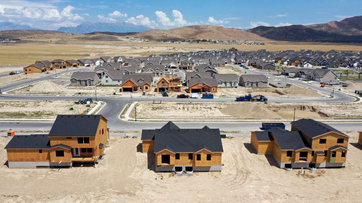 Single-family homes under construction in Eagle Mountain are pictured on July 19, 2022. Americans say President Donald Trump's on-again, off-again tariffs make them less likely to buy a home or make another major purchase this year.