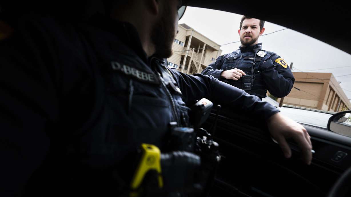 Salt Lake police detective Dalton Beebe, left, and officer Brad Donahoo, right, work in Salt Lake City on Thursday. Leaders passed memorandum of understanding with the Salt Lake City Police Association over a three-year agreement on Tuesday.