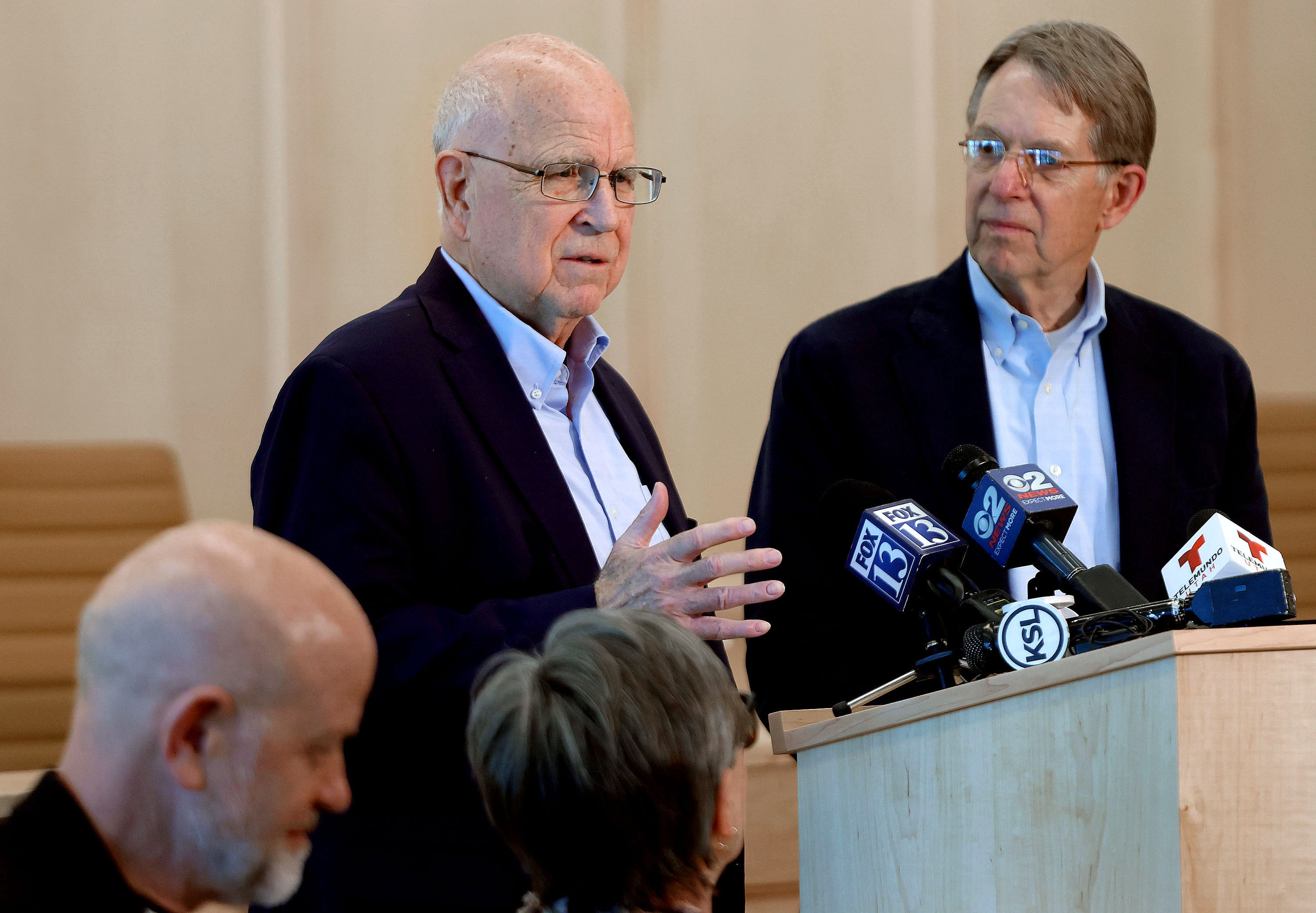 Richard Lambert, left, and Jim McConkie, attorneys with the Refugee Justice League, address concerns about letters received by two Millcreek families instructing them to leave the country at Millcreek City Hall on Friday.