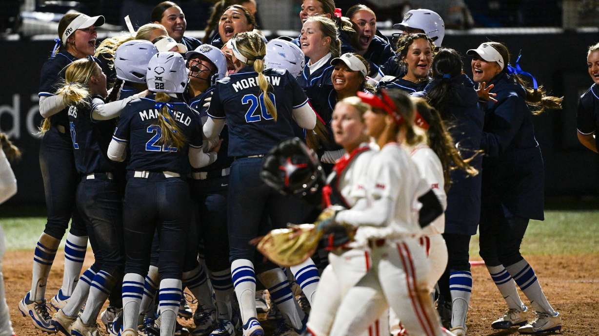 BYU celebrates at home plate after Aleia Agbayani hit a walkoff homerun giving the Cougars a 10-8 win over Utah in Provo on Friday, April 18, 2025.