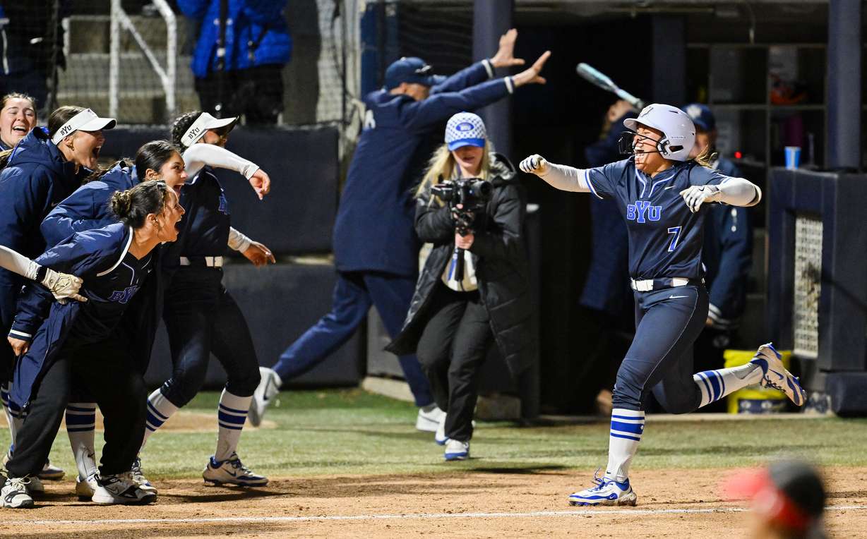 BYU’s Aleia Agbayani celebrates as she nears teammates and home plate after hitting a walkoff homerun giving the Cougars a 10-8 win over Utah in Provo on Friday, April 18, 2025.