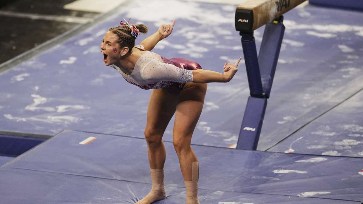 Oklahoma's Jordan Bowers celebrates after competing on the balance beam during the NCAA women's gymnastics championships in Fort Worth, Texas, Thursday, April 17, 2025.