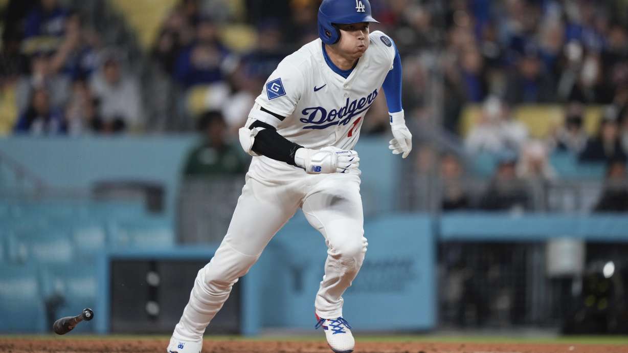 Los Angeles Dodgers' Shohei Ohtani runs to first as he grounds out during the eighth inning of a baseball game against the Colorado Rockies, Wednesday, April 16, 2025, in Los Angeles.