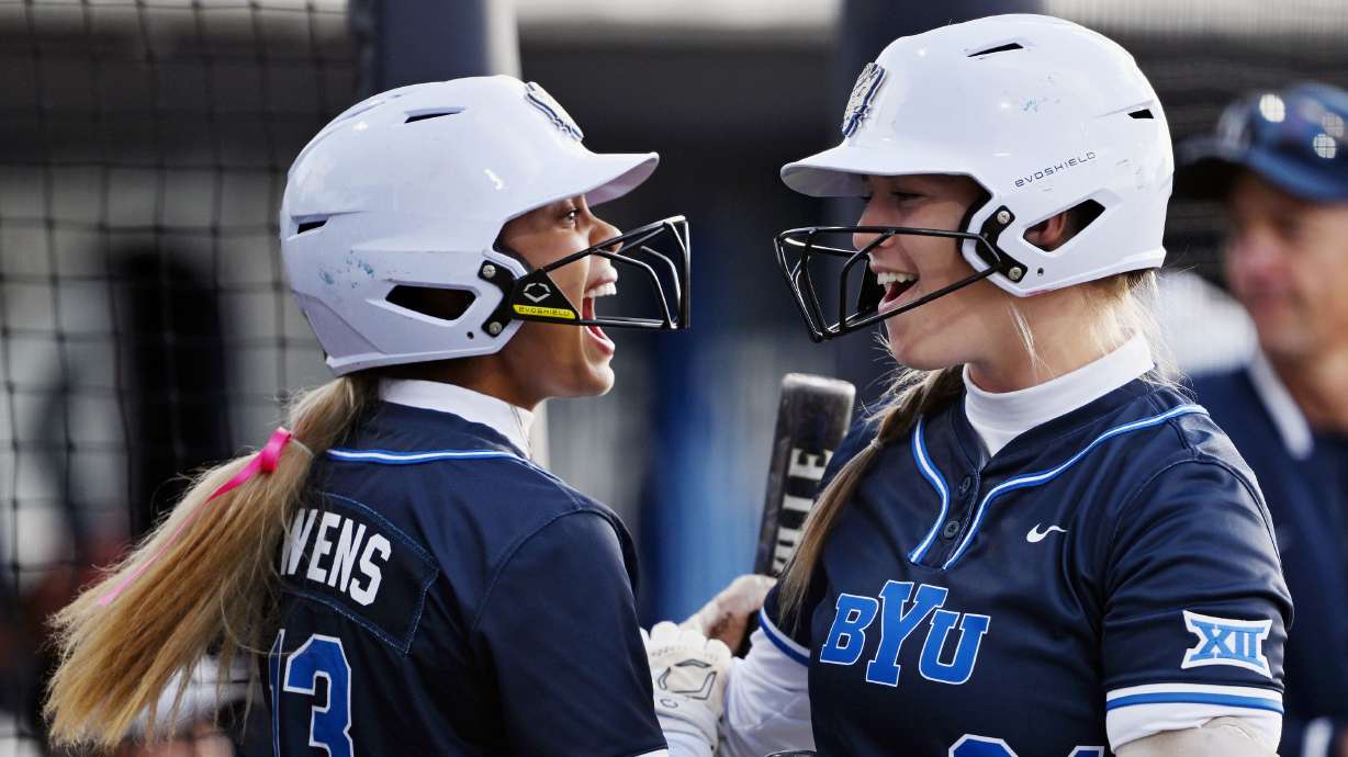 BYU’s Lily Owens and Maddie Udall-Woolley celebrate as BYU and Utah play softball in Provo on Friday, April 18, 2025. BYU won 10-8 on a walk-off home run.