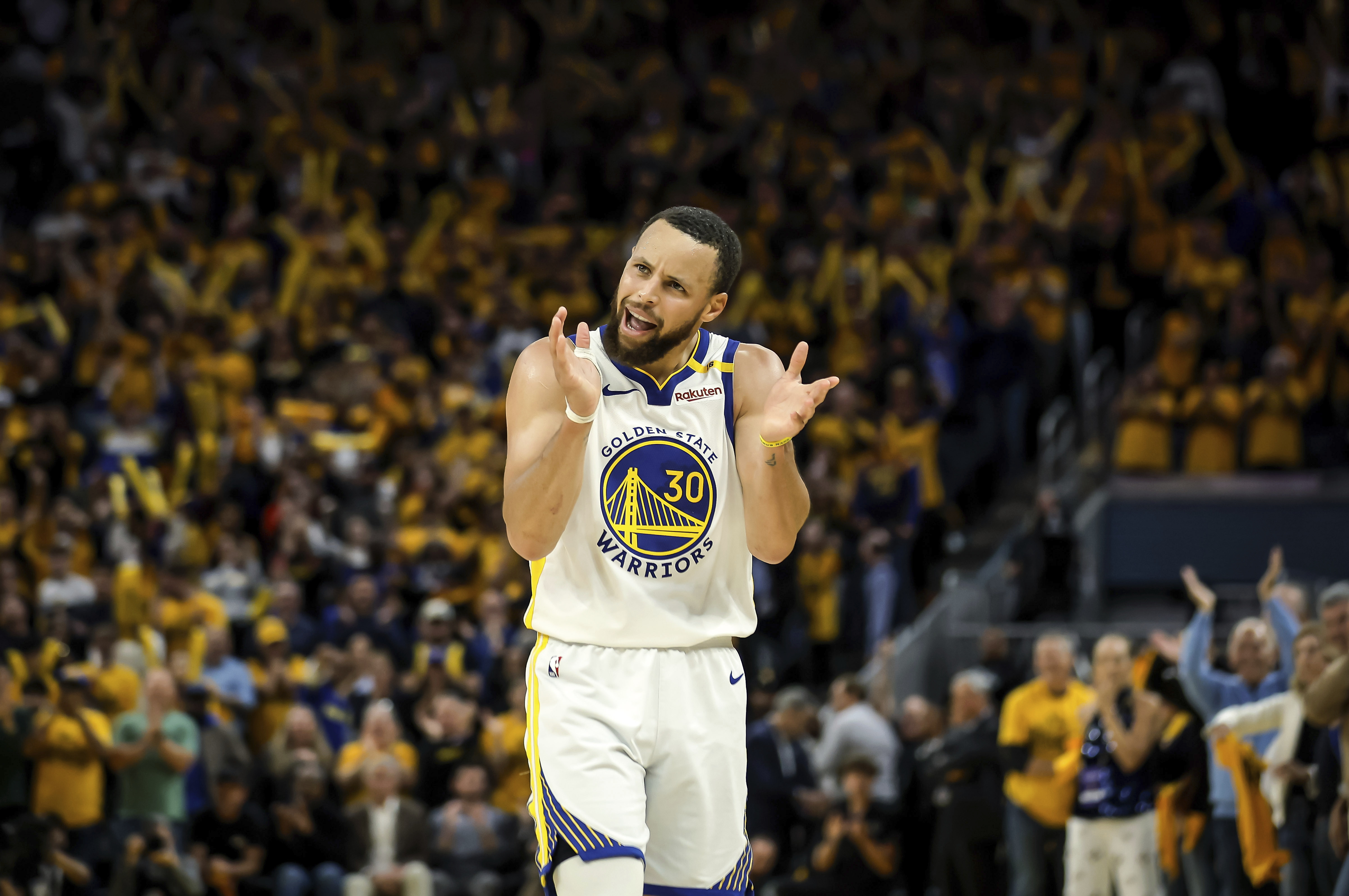 Golden State Warriors' Stephen Curry (30) claps and urges on the crowd in the second half of an NBA play-in tournament basketball game against the Memphis Grizzlies in San Francisco, on Tuesday, April 15, 2025.