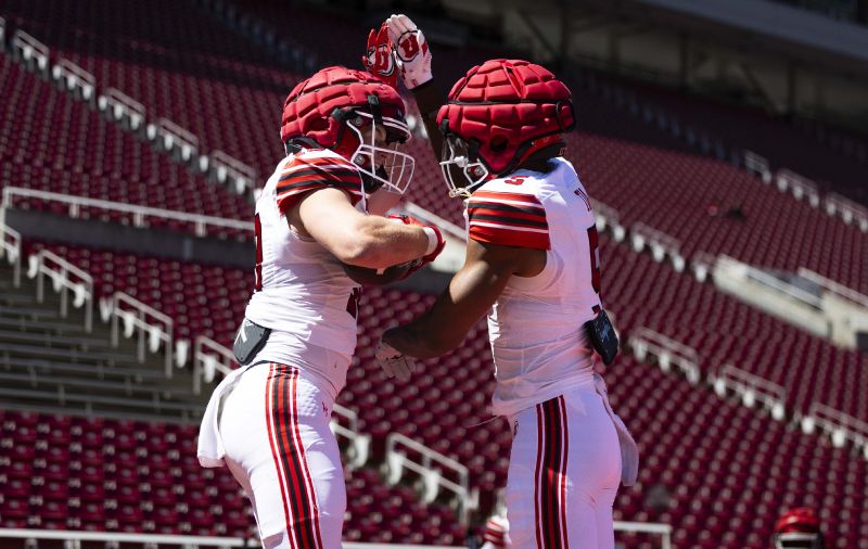 White team tight end Hunter Andrews (10) and Otto Tia (5) celebrate together after a touchdown by Andrews during the Utah Utes’ 22 Forever spring game at Rice-Eccles Stadium in Salt Lake City on Saturday, April 19, 2025. - Brice Tucker, Deseret News