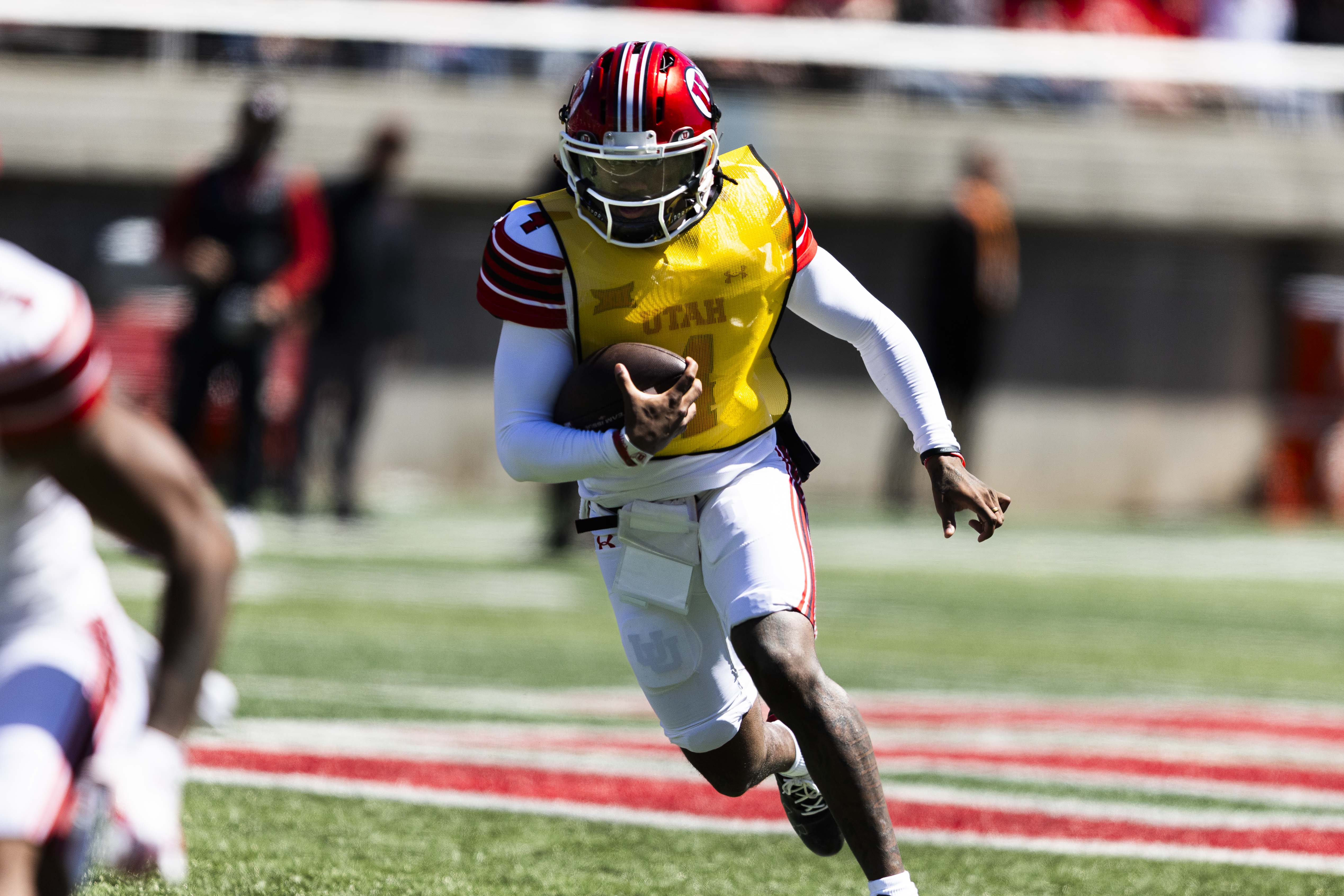 White team quarterback Devon Dampier (4) runs the ball down the field during the Utah Utes’ 22 Forever spring game at Rice-Eccles Stadium in Salt Lake City on Saturday, April 19, 2025.