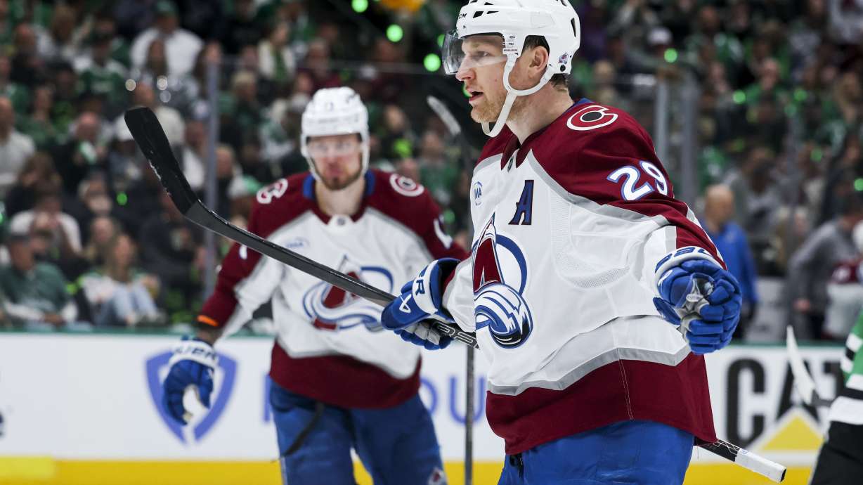Colorado Avalanche center Nathan MacKinnon (29) celebrates after scoring a power-play goal during a first-round NHL hockey playoff game against the Dallas Stars in Dallas, Saturday, April 19, 2025.