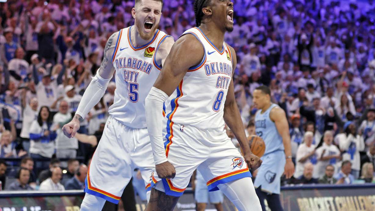 Oklahoma City Thunder center Isaiah Hartenstein, left, and forward Jalen Williams (8) react after a dunk by Williams during the first half in Game 1 of an NBA first-round playoff series against the Memphis Grizzles, Sunday, April 20, 2025, in Oklahoma City.