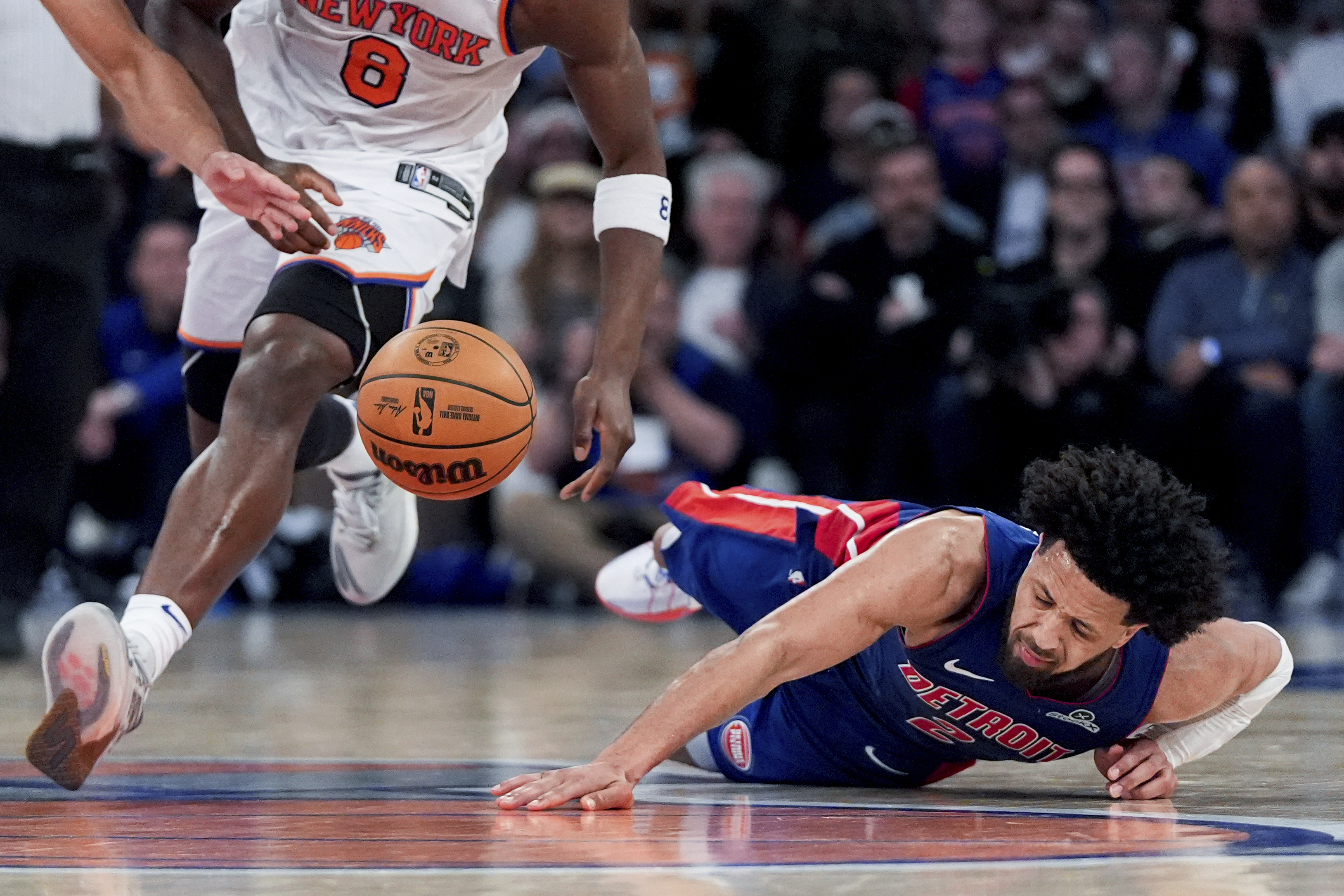 Detroit Pistons guard Cade Cunningham (2) falls during the second half of Game 1 in an NBA basketball first-round playoff series against the New York Knicks, Saturday, April 19, 2025, in New York.