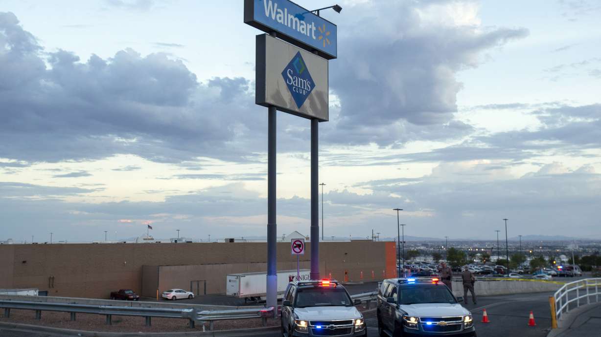 In this Aug. 3, 2019, photo, Texas state police cars block the access to the Walmart store in the aftermath of a mass shooting in El Paso, Texas. Victims' relatives and survivors of the racist attack began sharing their statements in court Monday afternoon.
