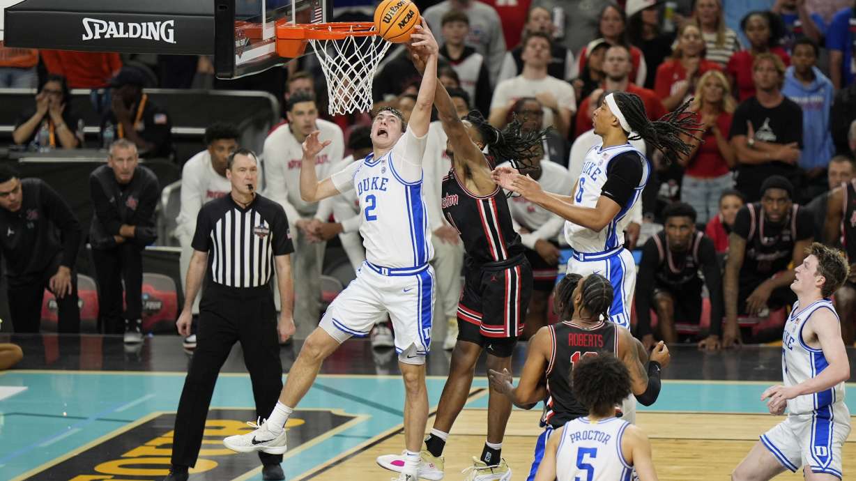 Duke's Cooper Flagg (2) shoots as Houston's Joseph Tugler (11) defends during the second half in the national semifinals at the Final Four of the NCAA college basketball tournament, Saturday, April 5, 2025, in San Antonio.