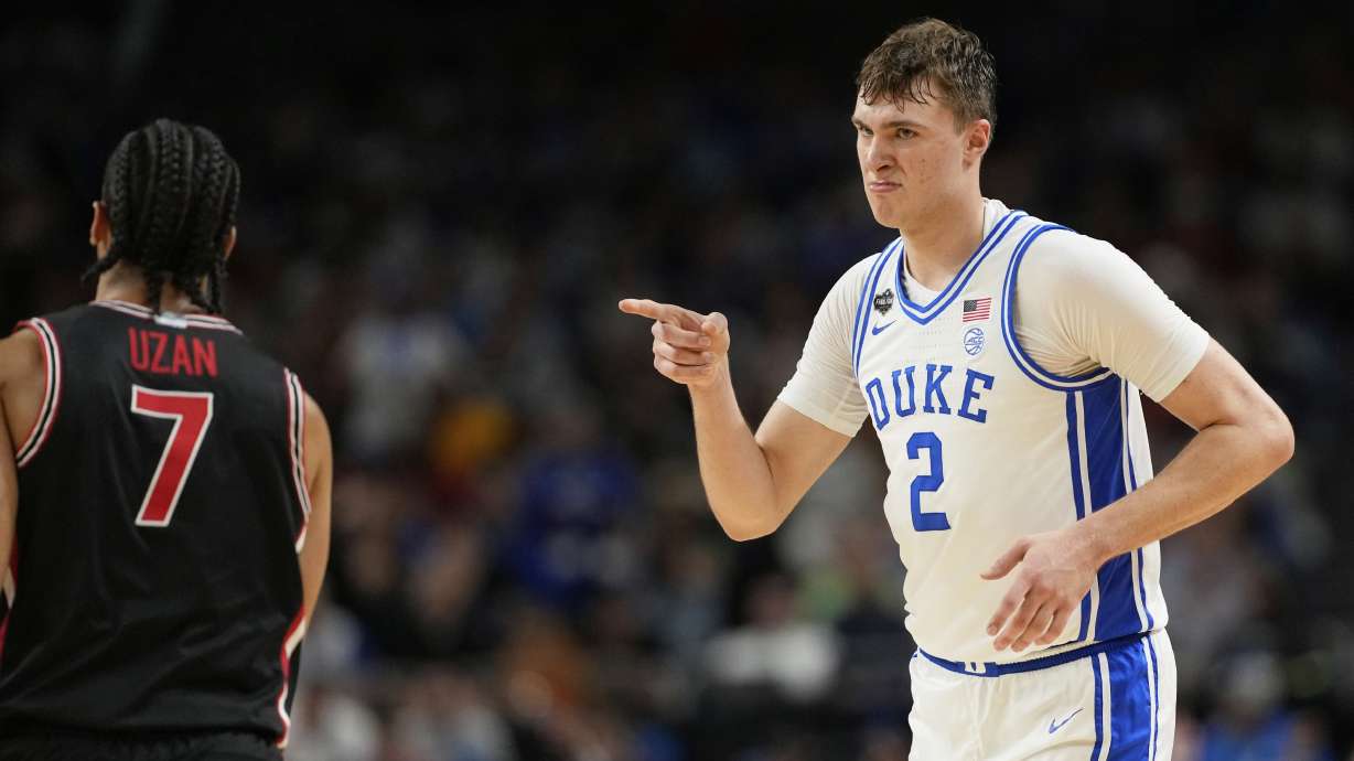 Duke's Cooper Flagg (2) points toward Houston's Milos Uzan (7) during the second half in the national semifinals at the Final Four of the NCAA college basketball tournament, Saturday, April 5, 2025, in San Antonio.