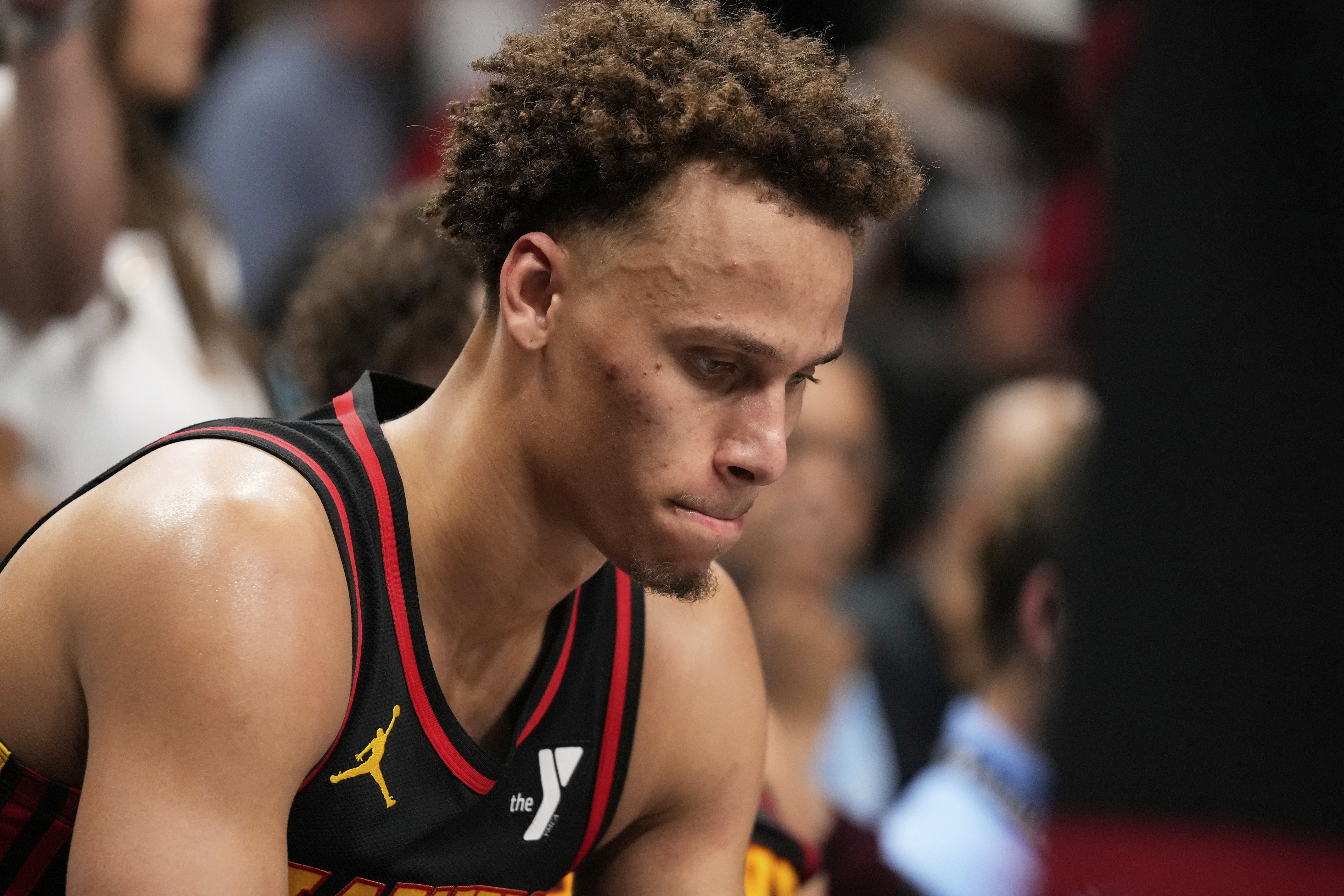 Atlanta Hawks guard Dyson Daniels (5) reacts to a loss on the bench in overtime of an NBA play-in tournament basketball game against the Miami Heat, Friday, April 18, 2025, in Atlanta.