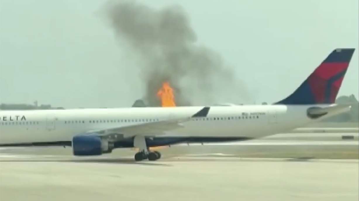An engine fire forces passengers to evacuate a Delta Air Lines plane on Monday at Orlando International Airport in Florida.
