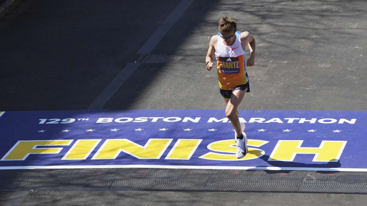 Conner Mantz, of the United States, crosses the finish line in fourth place during the Boston Marathon, Monday, April 21, 2025, in Boston.