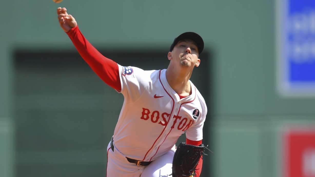 Boston Red Sox's Walker Buehler delivers a pitch to a Chicago White Sox batter in the first inning of a baseball game, Monday, April 21, 2025, in Boston.