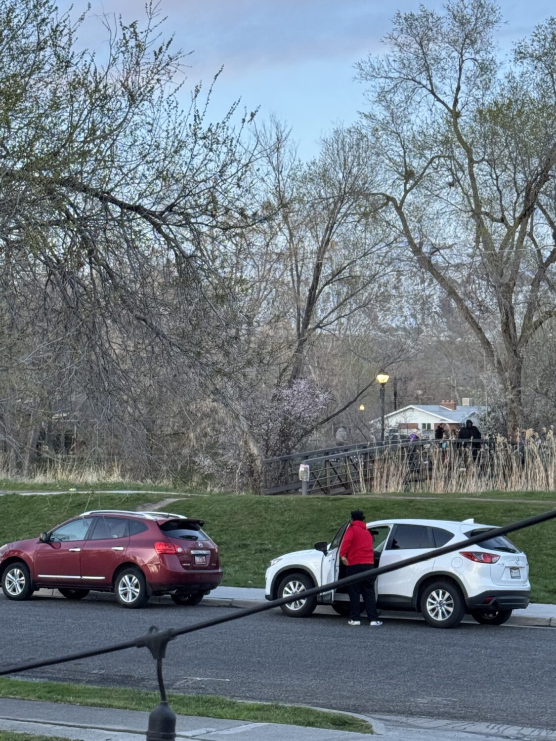 People gather at a bridge across the street from Aaron Sylvern’s residence along the Jordan River Trail in an undated photo.