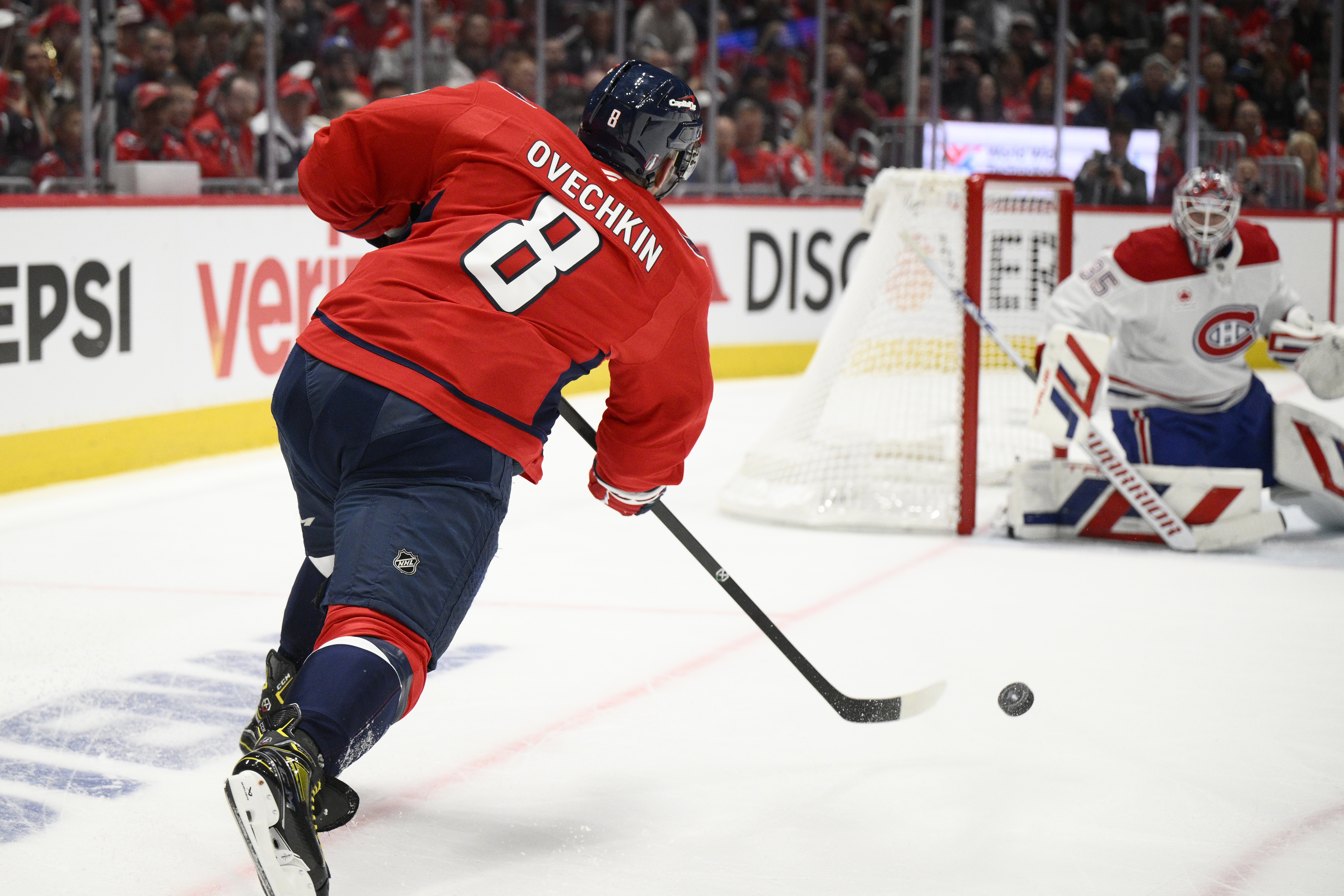 Washington Capitals left wing Alex Ovechkin (8) shoots against Montreal Canadiens goaltender Sam Montembeault (35) in the first period of Game 1 of a first-round NHL hockey playoff series Monday, April 21, 2025, in Washington.