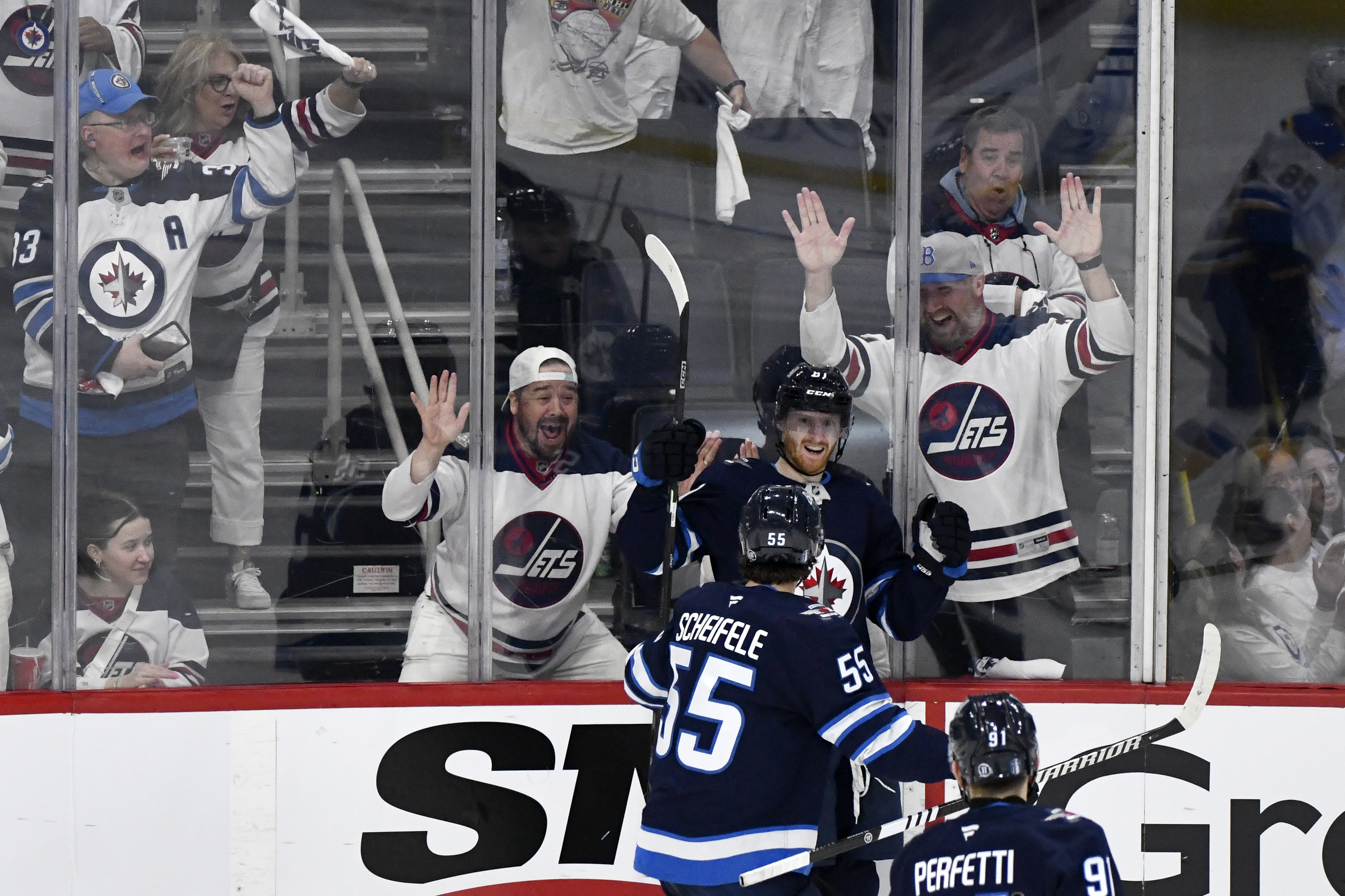 Winnipeg Jets' Kyle Connor (81) celebrates after his goal against the St. Louis Blues with Mark Scheifele (55) during the third period of Game 2 of a first-round NHL hockey playoff series in Winnipeg, Manitoba, Monday April 21, 2025.