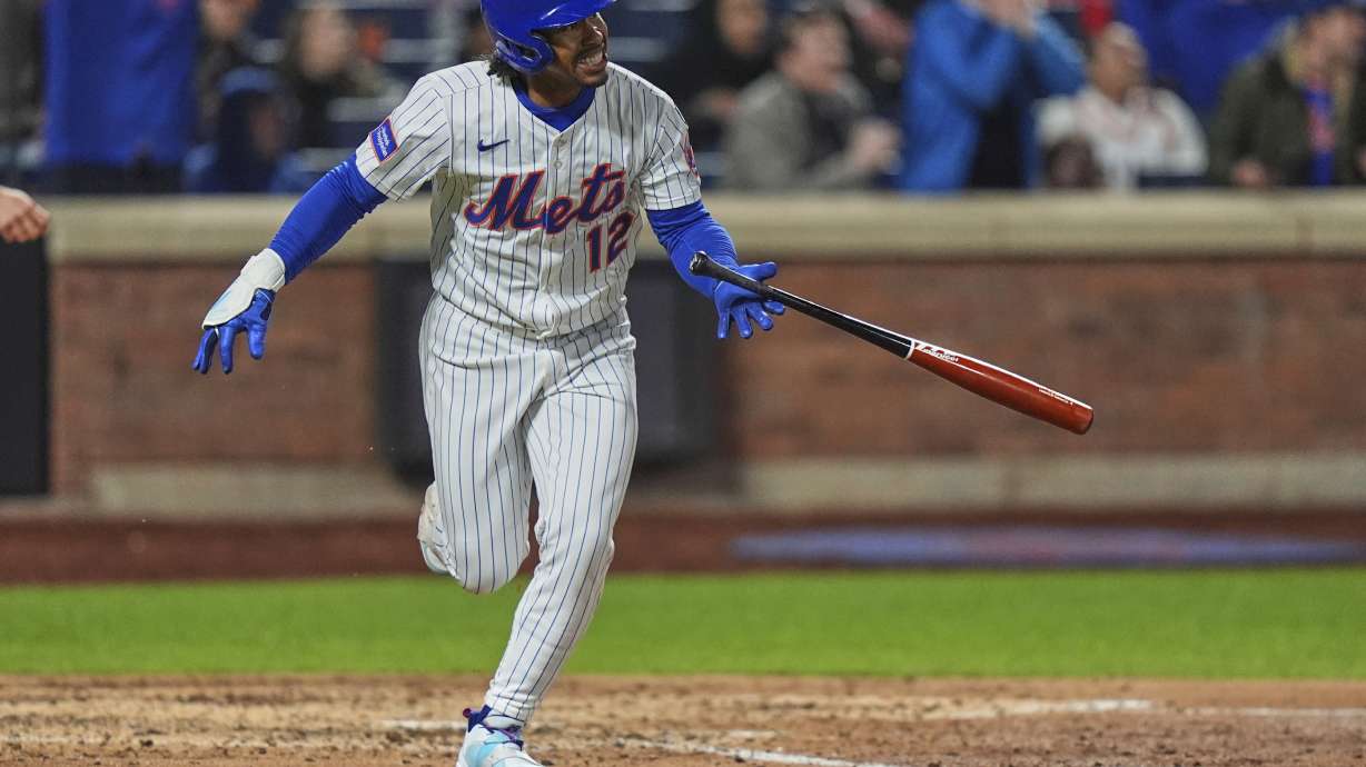 New York Mets' Francisco Lindor (12) reacts as he runs the bases after hitting a three-run home run during the seventh inning of a baseball game against the Philadelphia Phillies Monday, April 21, 2025, in New York.