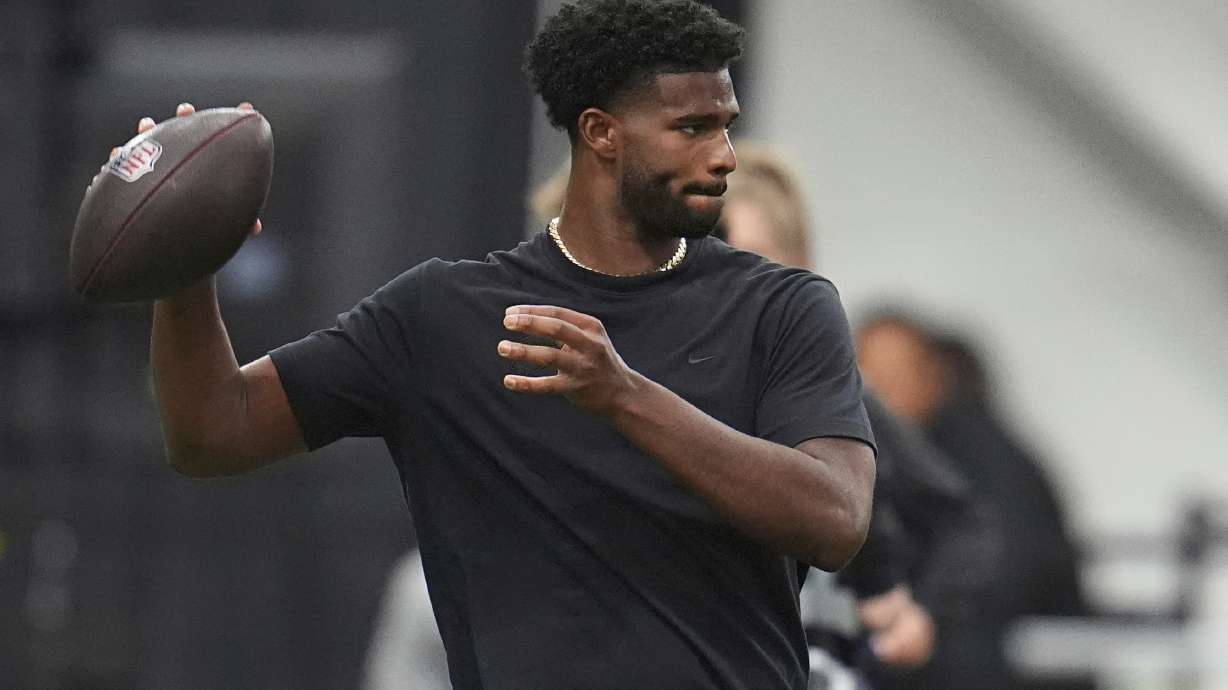 FILE - Colorado quarterback Shedeur Sanders (2) takes part in passing drills during Colorado's NFL football pro day Friday, April 4, 2025, in Boulder, Colo.