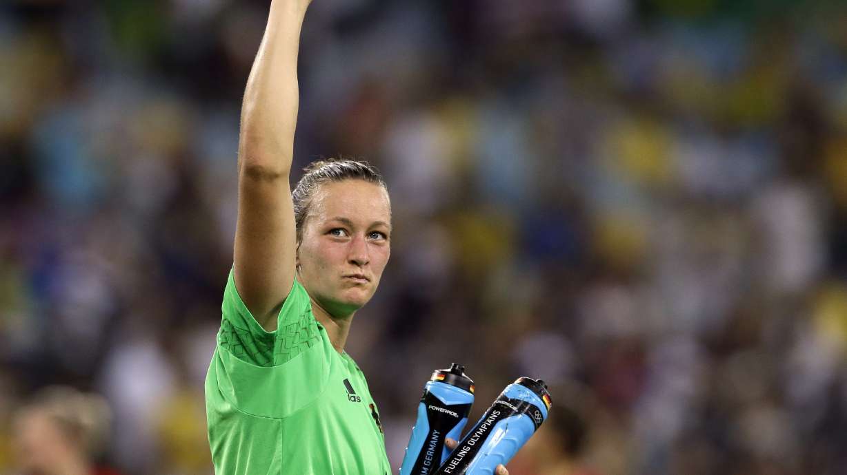 FILE - Germany goalkeeper Almuth Schult celebrates after winning the gold medal in the women's Olympic football tournament at the Maracana stadium in Rio de Janeiro, Brazil, Aug. 19, 2016.
