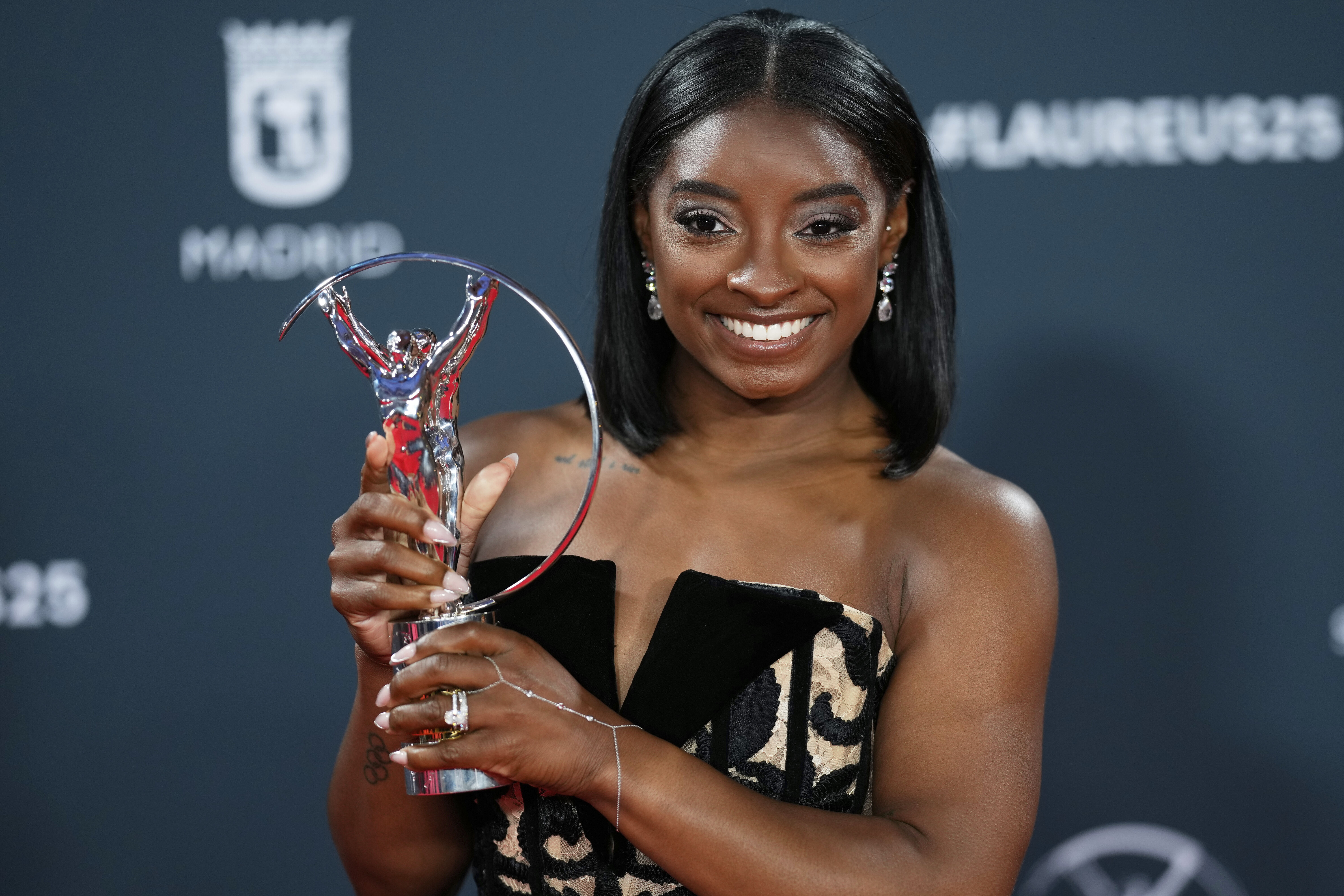 Simone Biles celebrates her Laureus World Sportswoman of the Year award, during the 2025 Laureus World Sports Awards ceremony in Madrid, Spain, Monday, April 21, 2025.