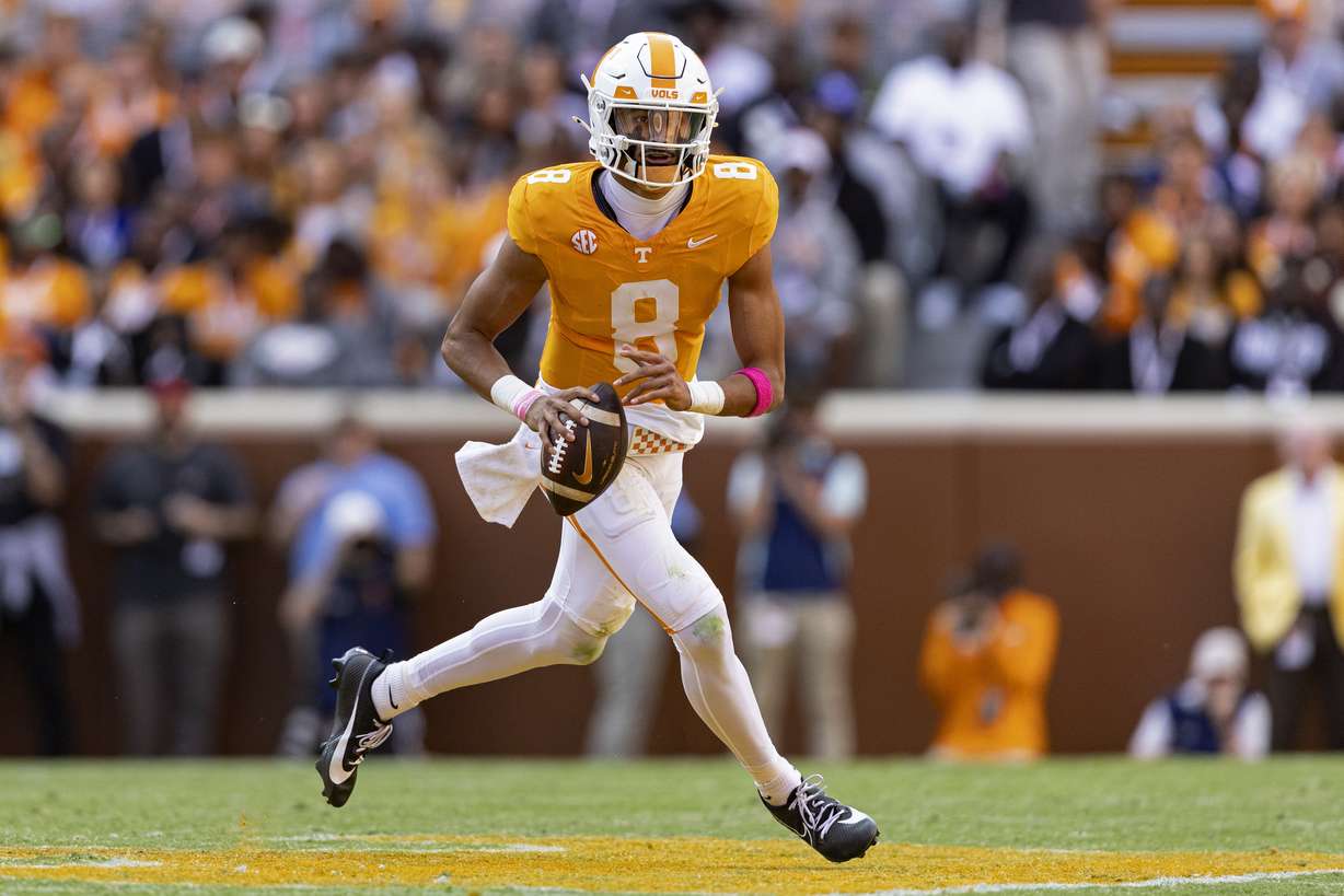 Tennessee quarterback Nico Iamaleava rolls out to pass during the first half of an NCAA college football game against Alabama, Saturday, Oct. 19, 2024, in Knoxville, Tenn.