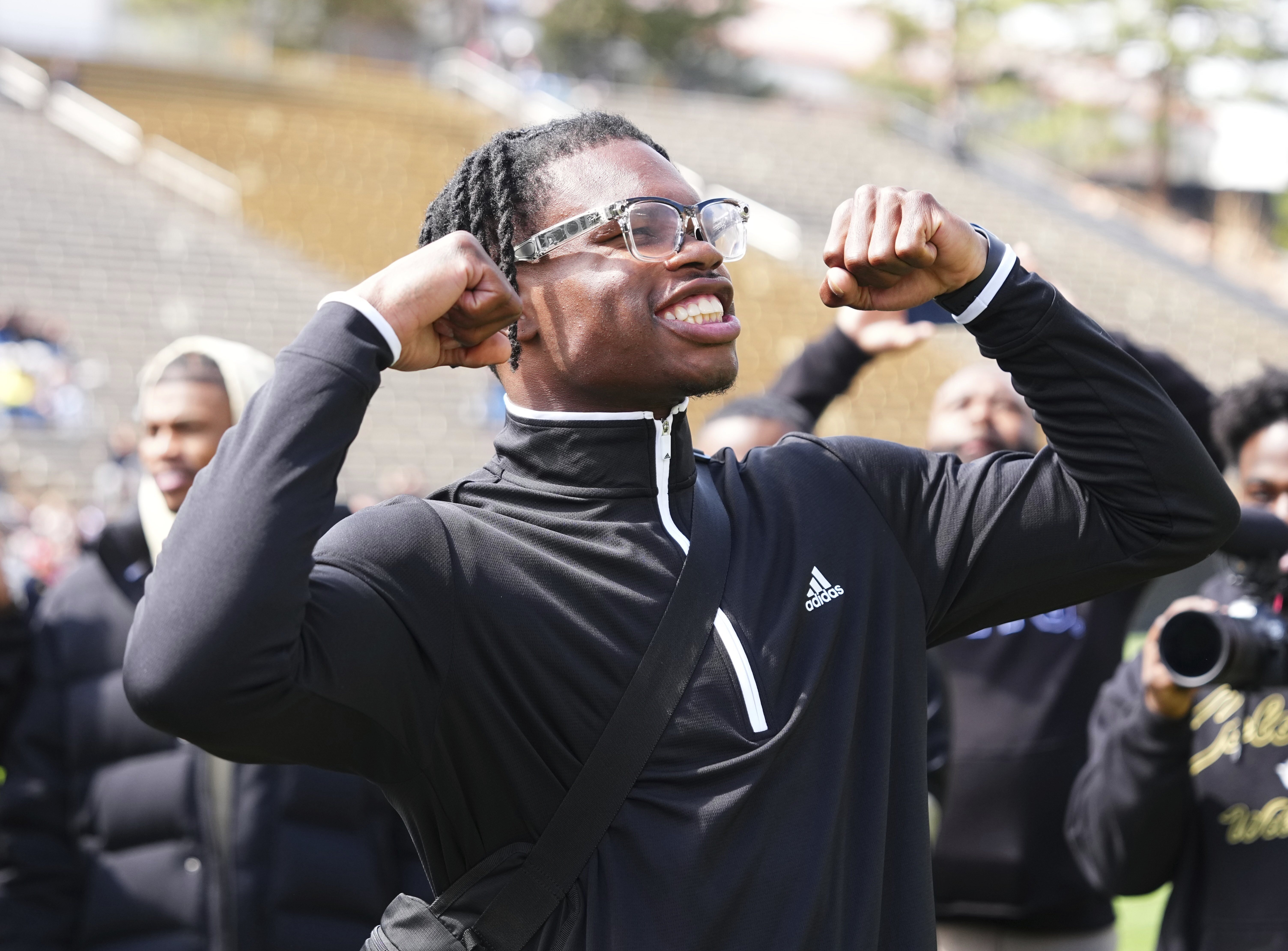 Travis Hunter reacts to his jersey retirement during Colorado's NCAA college football spring game, Saturday, April 19, 2025, in Boulder, Colo.