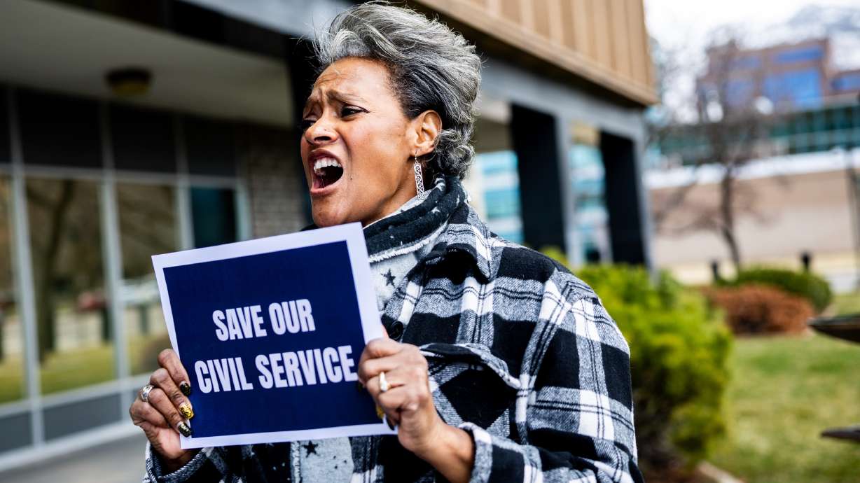 A job event geared to federal workers in Ogden is set for Wednesday. The March 15 photo shows Kim, employed by the IRS, at a workers rally at the James V. Hansen Federal Building in Ogden.