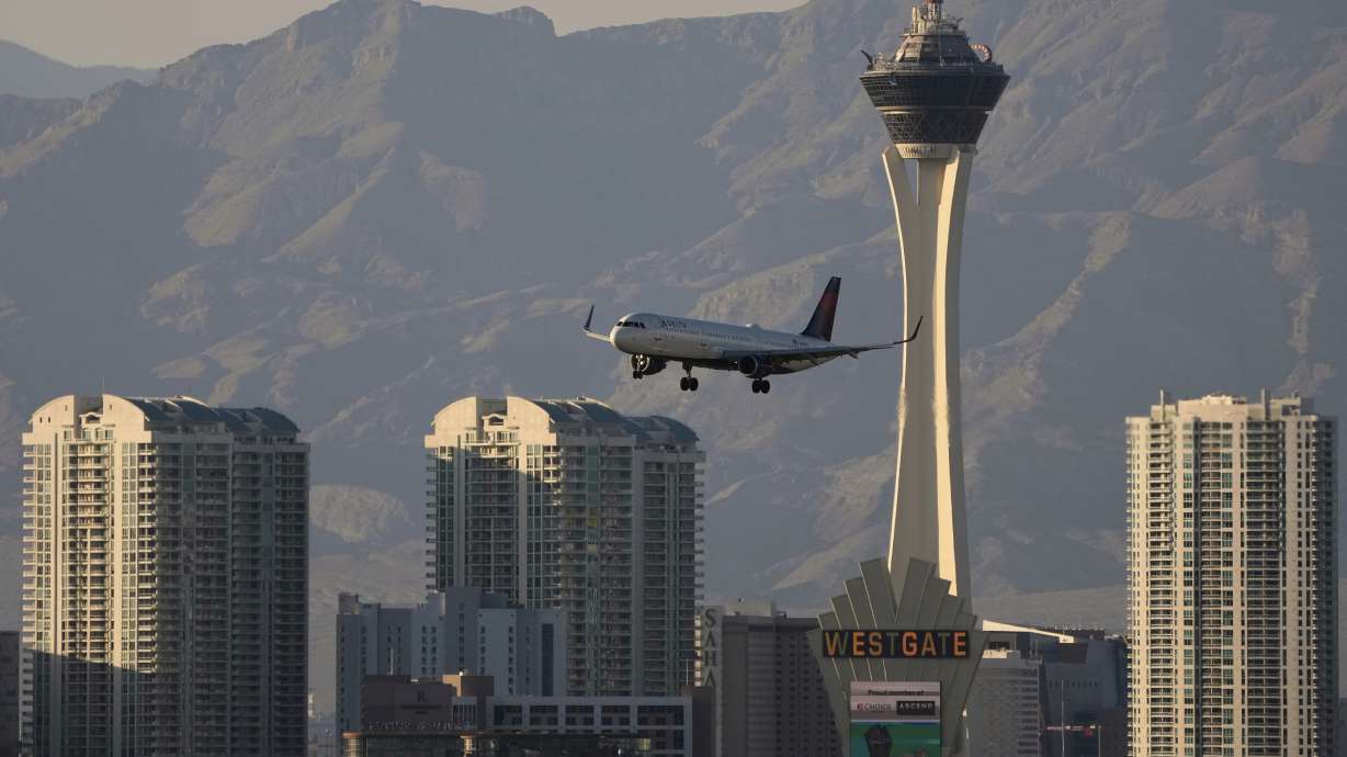 A Delta Air Lines flight lands at Harry Reid International Airport on April 9 in Las Vegas. A federal review of helicopter safety around the airport revealed dangerous flying conditions that exist.