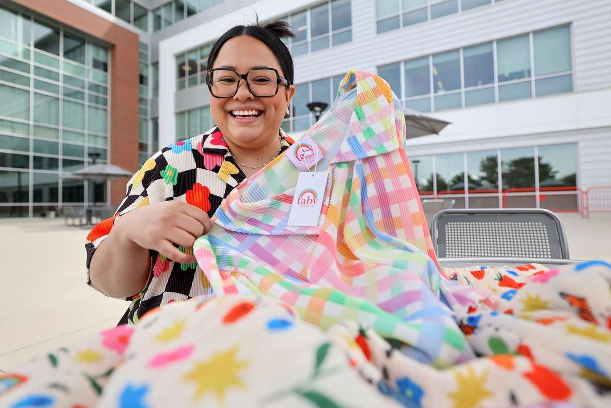 Taby Davila, Shop Taby founder and University of Utah Masters of Business Creation student, poses for a portrait with Shop Taby plisse sets at the University of Utah in Salt Lake City on Wednesday, April 2.