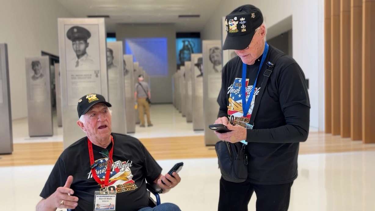 Merrill Wells (left) and Jim Hayes (right) talking about meeting General Benjamin O. Davis.