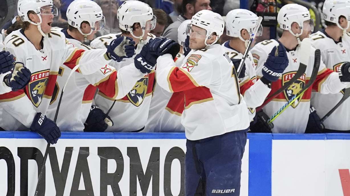 Florida Panthers left wing Matthew Tkachuk (19) celebrates with the bench after scoring against the Tampa Bay Lightning during the second period in Game 1 of an NHL hockey Stanley Cup first-round playoff series, Tuesday, April 22, 2025, in Tampa, Fla.
