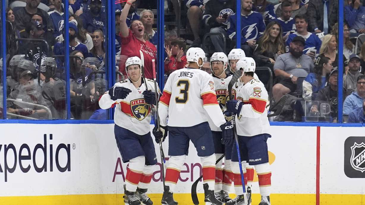 Florida Panthers left wing Matthew Tkachuk (19, left) celebrates with teammates, including defenseman Seth Jones (3) after scoring against the Tampa Bay Lightning during the second period in Game 1 of an NHL hockey Stanley Cup first-round playoff series, Tuesday, April 22, 2025, in Tampa, Fla.